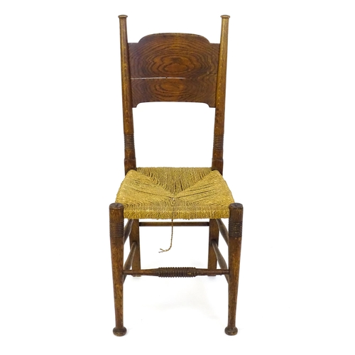 1361 - An Arts & Crafts chair designed by William Birch of High Wycombe, with turned tapering uprights and ... 