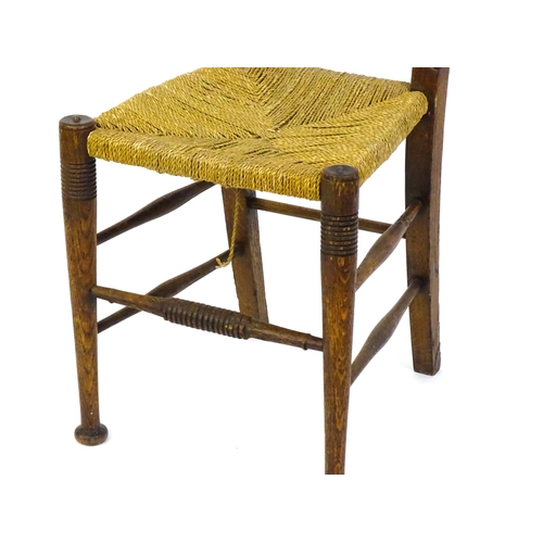 1361 - An Arts & Crafts chair designed by William Birch of High Wycombe, with turned tapering uprights and ... 