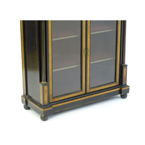 1362 - A 19thC pier cabinet with burr walnut veneers, an ebonised finish and inlaid satinwood stringing. Th... 