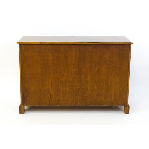 1364 - A 20thC sideboard / dresser base with a crossbanded top and two long over three short drawers flanke... 