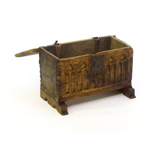 1366 - A 17thC and later bible box with a hinged lid, lancet carved front and raised on later shaped feet. ... 