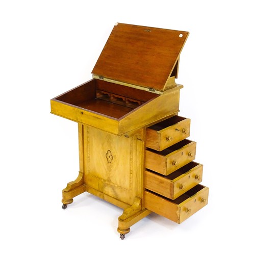 1373 - A late 19thC walnut Davenport with a fitted writing compartment to the top and an inset leather writ... 