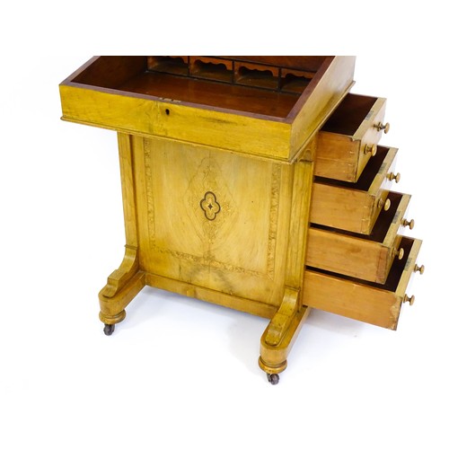 1373 - A late 19thC walnut Davenport with a fitted writing compartment to the top and an inset leather writ... 