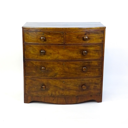 1376 - A 19thC mahogany bow fronted chest of drawers with two short drawers over three long graduated drawe... 