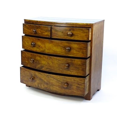 1376 - A 19thC mahogany bow fronted chest of drawers with two short drawers over three long graduated drawe... 