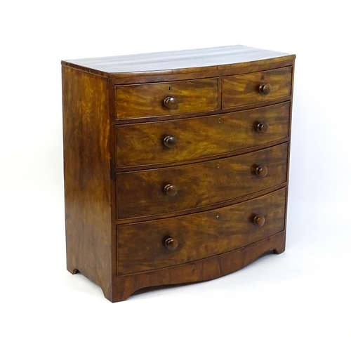 1376 - A 19thC mahogany bow fronted chest of drawers with two short drawers over three long graduated drawe... 