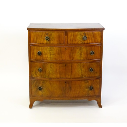 1377 - An early 20thC mahogany chest of drawers, comprising two shorts over three long graduated drawers wi... 