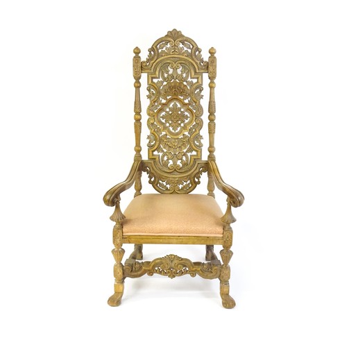 1378 - A 20thC Carolean style armchair, with a carved and pierced backrest, floral decoration, turned taper... 