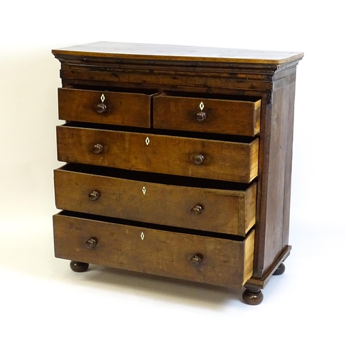 1381 - An 18thC oak chest of drawers with a rectangular top above two short over three long graduated drawe... 