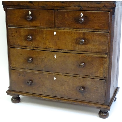 1381 - An 18thC oak chest of drawers with a rectangular top above two short over three long graduated drawe... 