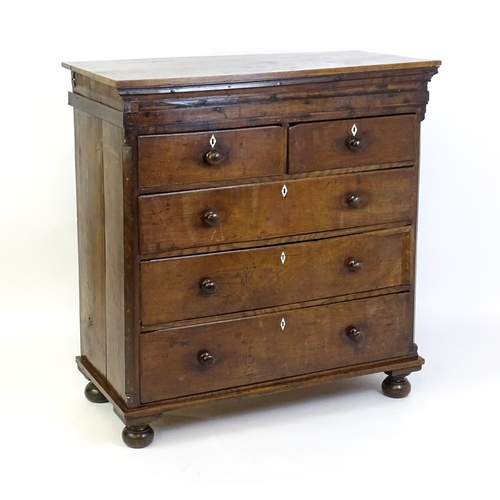 1381 - An 18thC oak chest of drawers with a rectangular top above two short over three long graduated drawe... 