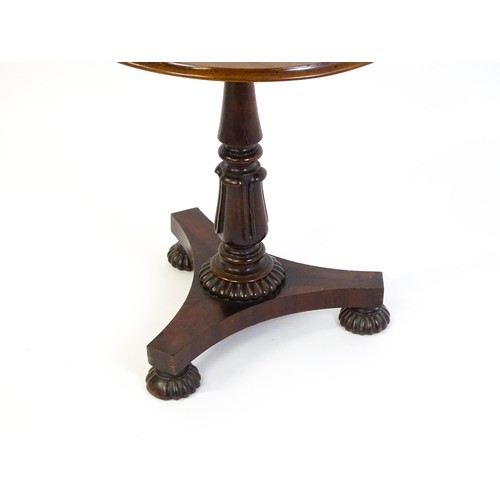 1386 - A mid 19thC rosewood occasional table, with circular thumb moulded top above a tapering pedestal and... 