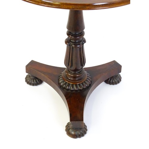 1386 - A mid 19thC rosewood occasional table, with circular thumb moulded top above a tapering pedestal and... 