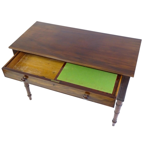 1387 - An early 19thC mahogany desk with a reeded edge above a single long drawer and two short drawers and... 