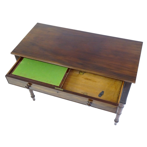 1387 - An early 19thC mahogany desk with a reeded edge above a single long drawer and two short drawers and... 