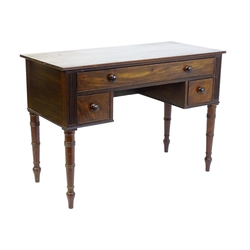 1387 - An early 19thC mahogany desk with a reeded edge above a single long drawer and two short drawers and... 