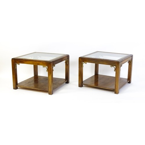 1394 - A pair of late 20thC coffee tables with glass tops, gilt mouldings and Anglo-Japanese style brackets... 