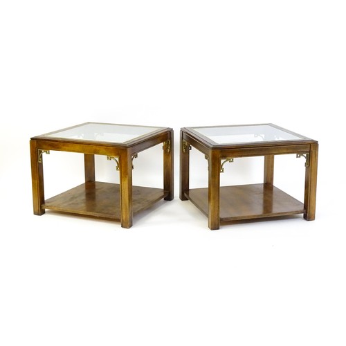 1394 - A pair of late 20thC coffee tables with glass tops, gilt mouldings and Anglo-Japanese style brackets... 