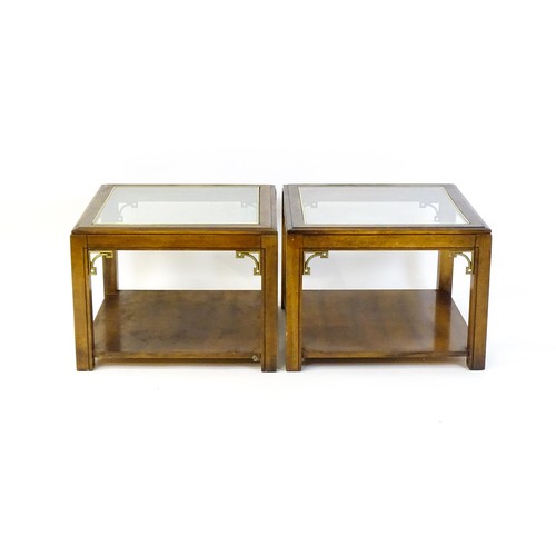 1394 - A pair of late 20thC coffee tables with glass tops, gilt mouldings and Anglo-Japanese style brackets... 