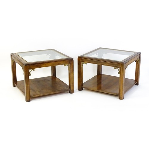 1394 - A pair of late 20thC coffee tables with glass tops, gilt mouldings and Anglo-Japanese style brackets... 