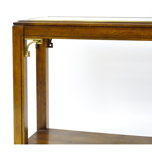 1395 - A late 20thC side table of rectangular form with a glass top, gilt mouldings and brackets to the apr... 