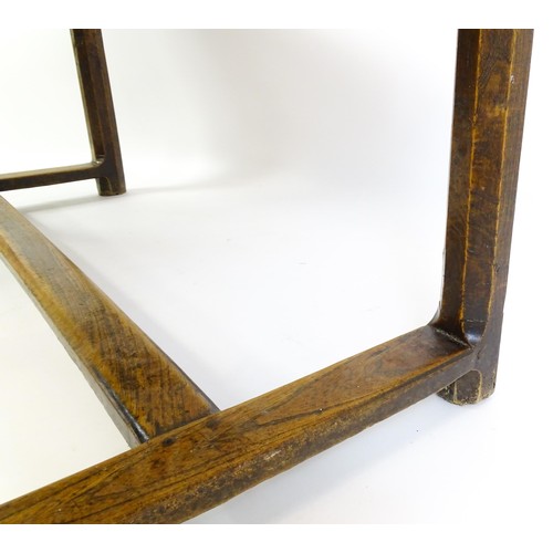 1397 - An 18thC and later refectory style table / desk with a planked top above a small frieze drawer, the ... 