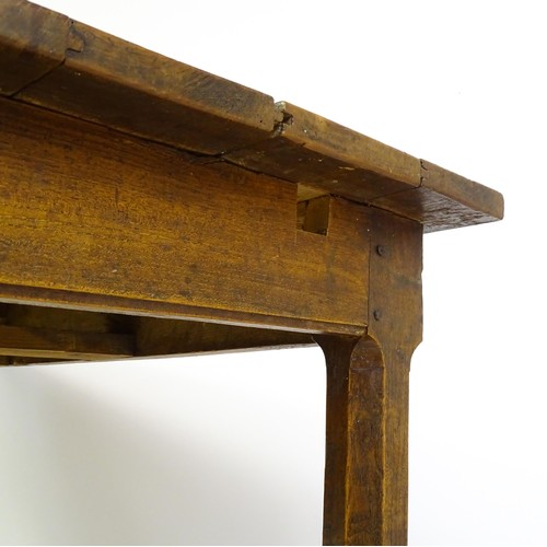 1397 - An 18thC and later refectory style table / desk with a planked top above a small frieze drawer, the ... 