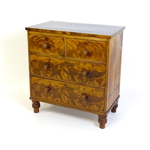 1402 - An early 19thC mahogany chest of drawers with a rectangular top above two short over two long drawer... 