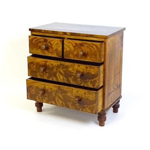 1402 - An early 19thC mahogany chest of drawers with a rectangular top above two short over two long drawer... 