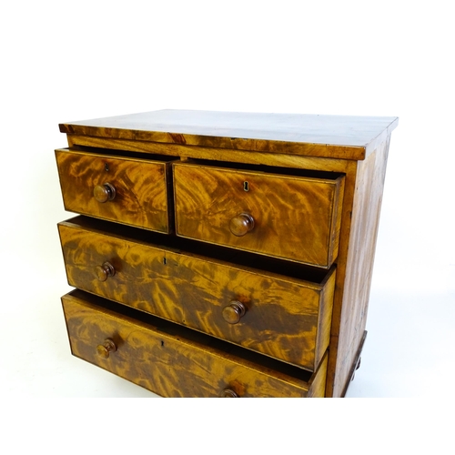 1402 - An early 19thC mahogany chest of drawers with a rectangular top above two short over two long drawer... 