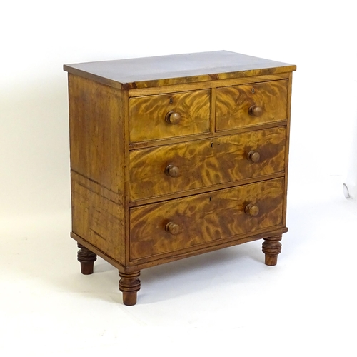 1402 - An early 19thC mahogany chest of drawers with a rectangular top above two short over two long drawer... 