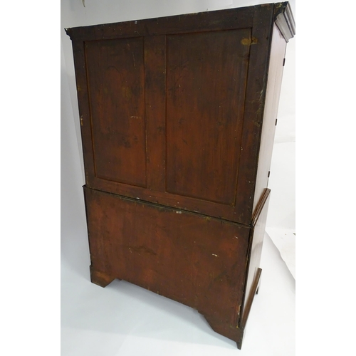 1404 - A mid to late 18thC mahogany linen press with dentil moulded cornice, two well figured panelled door... 