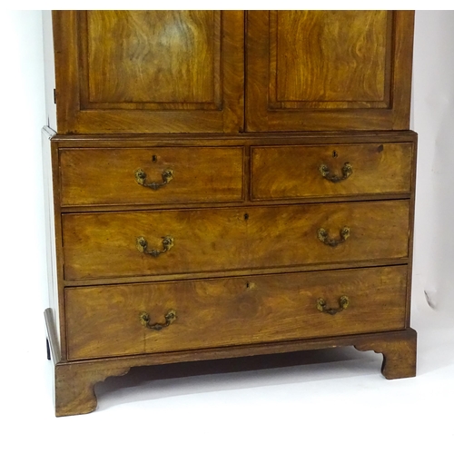 1404 - A mid to late 18thC mahogany linen press with dentil moulded cornice, two well figured panelled door... 