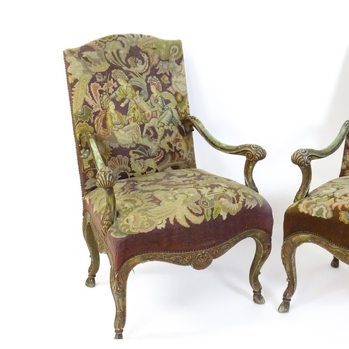 1406 - A pair of 20thC open armchairs, with shaped top rails, shaped arms with carved and scrolled decorati... 