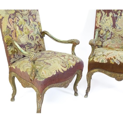 1406 - A pair of 20thC open armchairs, with shaped top rails, shaped arms with carved and scrolled decorati... 