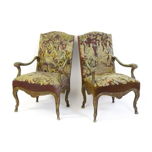 1406 - A pair of 20thC open armchairs, with shaped top rails, shaped arms with carved and scrolled decorati... 