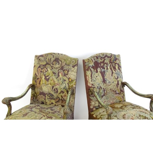 1406 - A pair of 20thC open armchairs, with shaped top rails, shaped arms with carved and scrolled decorati... 