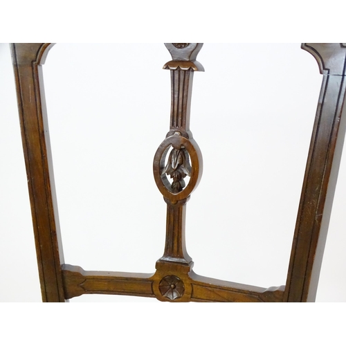 1407 - A pair of Edwardian walnut side chairs with carved cresting rails, pierced floral back splats and ra... 