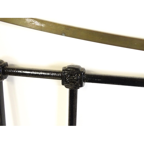 1421 - A 19thC painted iron bed with gilt highlights. Measuring 54