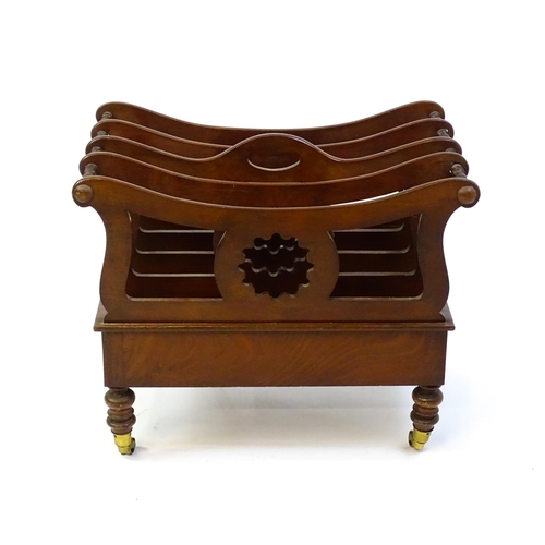 1427 - A mid 19thC mahogany Canterbury with a pierced handle, four sections with bowed top rails and pierce... 