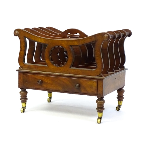 1427 - A mid 19thC mahogany Canterbury with a pierced handle, four sections with bowed top rails and pierce... 