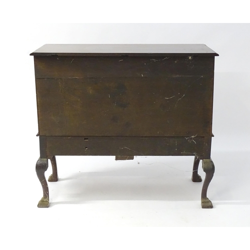 1433 - A 19thC Chippendale style cabinet, with a gadrooned rectangular top above two moulded and panelled d... 