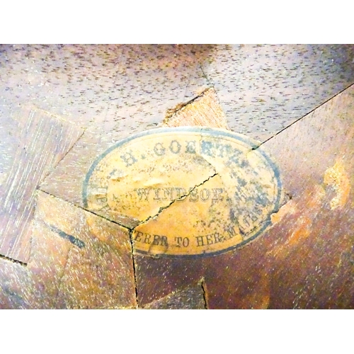 1436 - A mid / late 19thC mahogany occasional table with three drop leaves, the table bearing a label H. Go... 