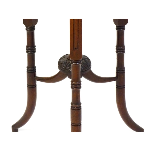 1436 - A mid / late 19thC mahogany occasional table with three drop leaves, the table bearing a label H. Go... 