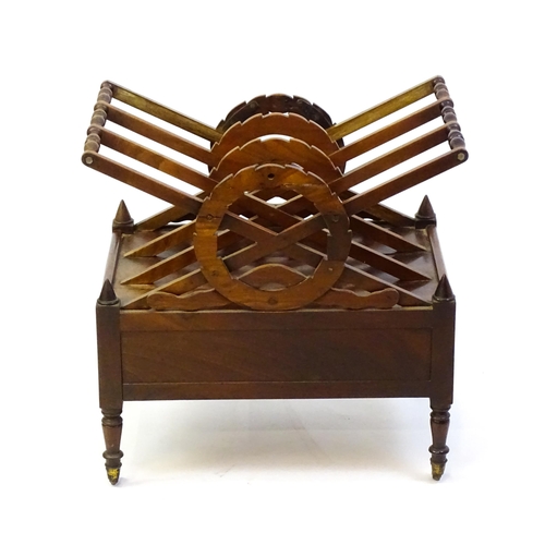 1442 - A mid 19thC mahogany Canterbury with three x-formed sections with laurel wreath style centres above ... 