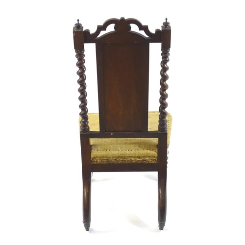 1450 - A 19thC rosewood chair with a pierced cresting rail above barley twist supports and raised on turned... 