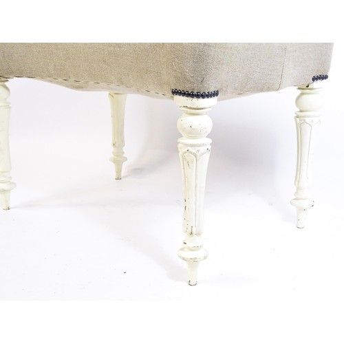 1455 - A 20thC white painted stool with an upholstered top with a concave shaped top raised on fluted turne... 