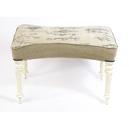 1455 - A 20thC white painted stool with an upholstered top with a concave shaped top raised on fluted turne... 