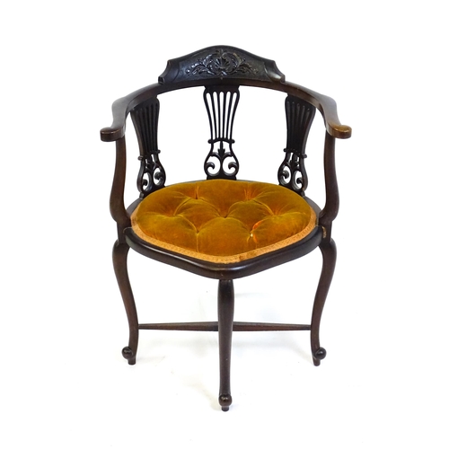 1457 - An early 20thC mahogany bow back chair with a carved cresting rail above three pierced, fanned back ... 