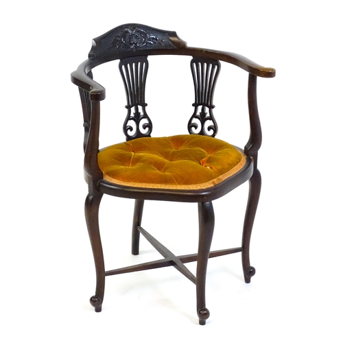 1457 - An early 20thC mahogany bow back chair with a carved cresting rail above three pierced, fanned back ... 